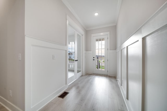 7233 Richvale Dr W, Fairview, TN 37062 - entryway with a decorative wall, wainscoting, light wood-style floors, and crown molding