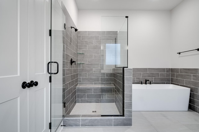 7233 Richvale Dr W, Fairview, TN 37062 - full bath with a shower stall, a soaking tub, tile walls, and tile patterned floors