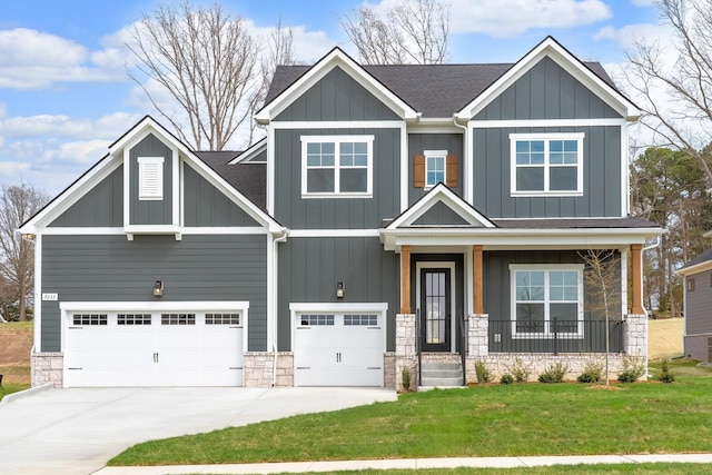 7233 Richvale Dr W, Fairview, TN 37062 - craftsman-style house with a front lawn, a garage, stone siding, and board and batten siding