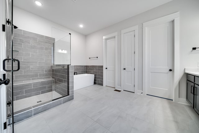 7233 Richvale Dr W, Fairview, TN 37062 - bathroom featuring a soaking tub, a stall shower, vanity, tile patterned floors, and recessed lighting