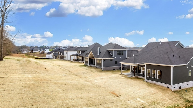 7233 Richvale Dr W, Fairview, TN 37062 - back of property featuring crawl space, a sunroom, a residential view, and a shingled roof