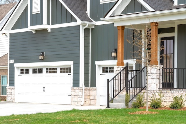 7233 Richvale Dr W, Fairview, TN 37062 - view of front of house featuring board and batten siding, an attached garage, and roof with shingles