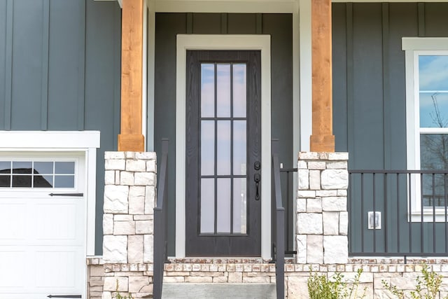 7233 Richvale Dr W, Fairview, TN 37062 - view of exterior entry with stone siding, board and batten siding, and a porch