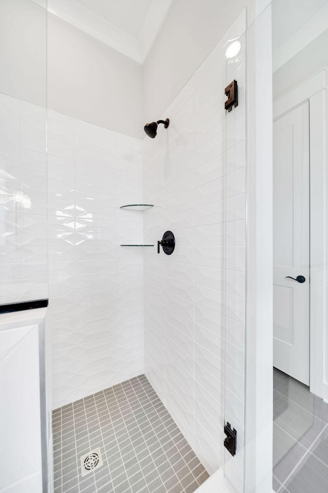 7428 Twill Heights Loop W, Fairview, TN 37062 - bathroom with a tile shower, tile patterned flooring, and crown molding
