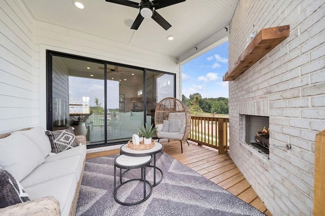 7428 Twill Heights Loop W, Fairview, TN 37062 - wooden terrace with ceiling fan and an outdoor living space with a fireplace
