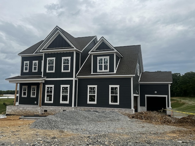 7428 Twill Heights Loop W, Fairview, TN 37062 - view of front facade featuring an attached garage, board and batten siding, and a shingled roof