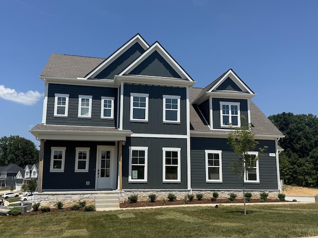 7428 Twill Heights Loop W, Fairview, TN 37062 - craftsman house with a front yard, board and batten siding, and a porch