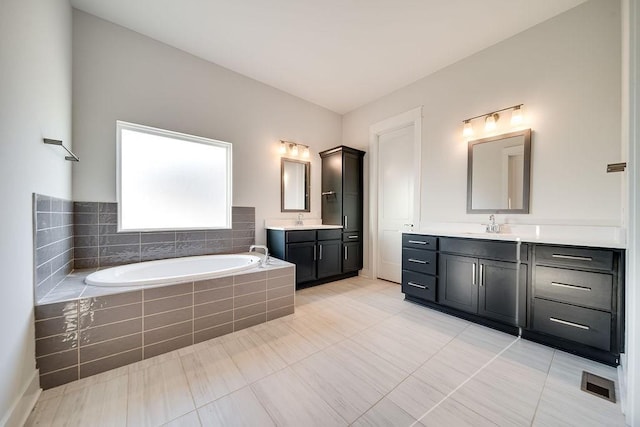 7262 Fairlawn Dr, Fairview, TN 37062 - full bath featuring a garden tub, two vanities, and tile patterned floors