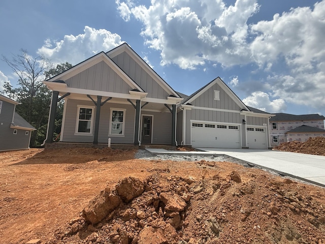 7262 Fairlawn Dr, Fairview, TN 37062 - craftsman inspired home with board and batten siding, a garage, driveway, and covered porch