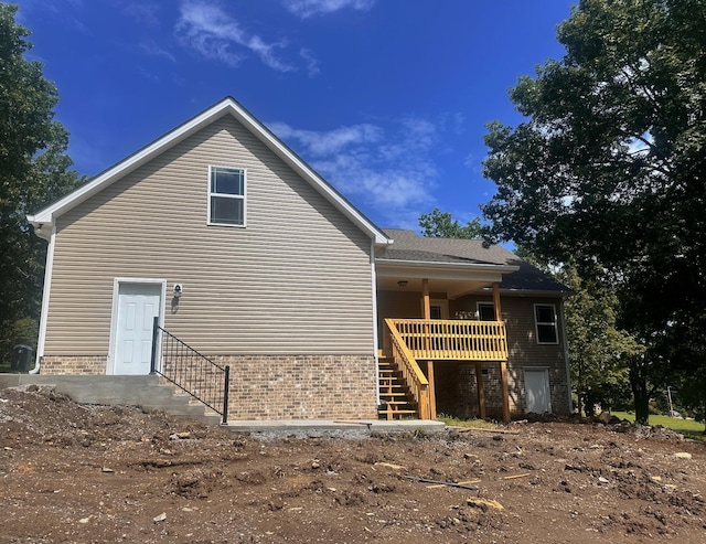 307 Ledgeview Dr, Shelbyville, TN 37160 - view of home's exterior with stairs, brick siding, and a wooden deck