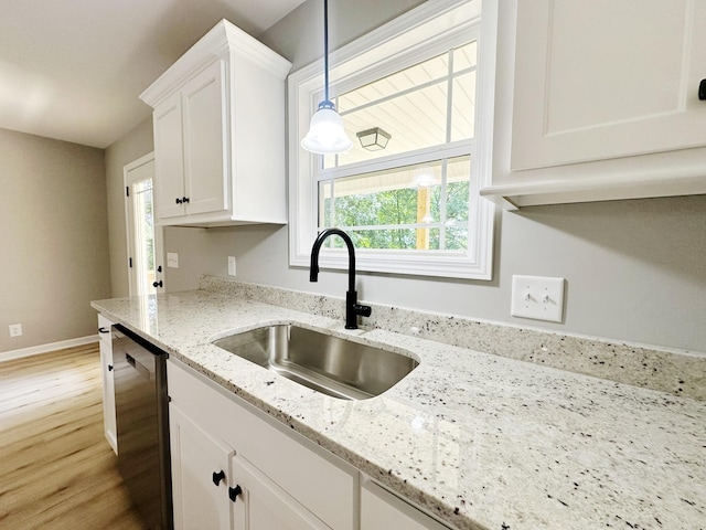 307 Ledgeview Dr, Shelbyville, TN 37160 - kitchen featuring stainless steel dishwasher, white cabinetry, light wood-style flooring, and healthy amount of natural light