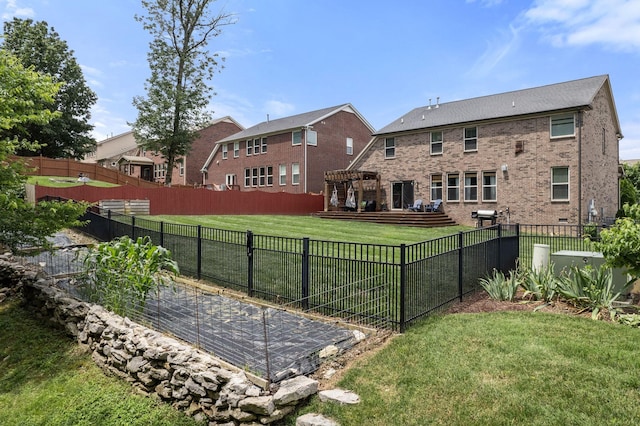 1301 Drury Ln, Mount Juliet, TN 37122 - rear view of house featuring a fenced backyard, brick siding, a garden, and a deck