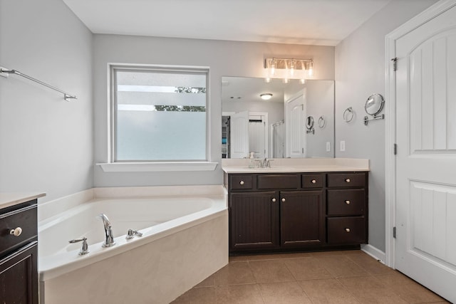 1301 Drury Ln, Mount Juliet, TN 37122 - bathroom with vanity, a garden tub, and tile patterned floors