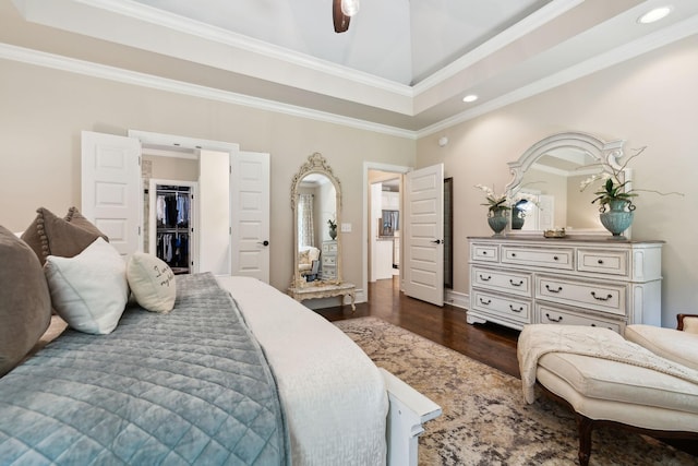 624 Twin View Dr, Murfreesboro, TN 37128 - bedroom with a raised ceiling, dark wood finished floors, recessed lighting, crown molding, and a walk in closet