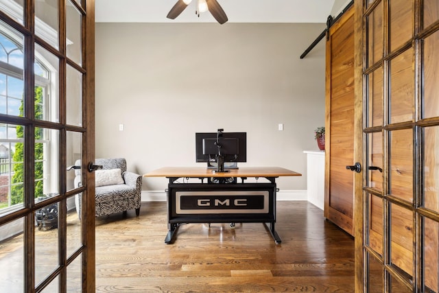 624 Twin View Dr, Murfreesboro, TN 37128 - home office featuring french doors, ceiling fan, dark wood-type flooring, and a barn door