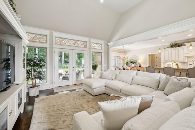 624 Twin View Dr, Murfreesboro, TN 37128 - living room with high vaulted ceiling, french doors, healthy amount of natural light, dark wood-style flooring, and a chandelier