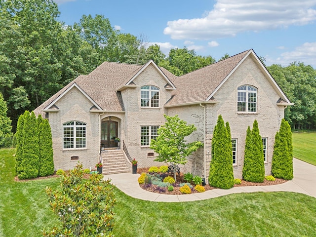 624 Twin View Dr, Murfreesboro, TN 37128 - view of front of house with brick siding, a front lawn, french doors, and a shingled roof