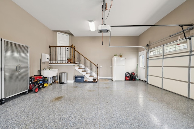 624 Twin View Dr, Murfreesboro, TN 37128 - garage with freestanding refrigerator and a garage door opener