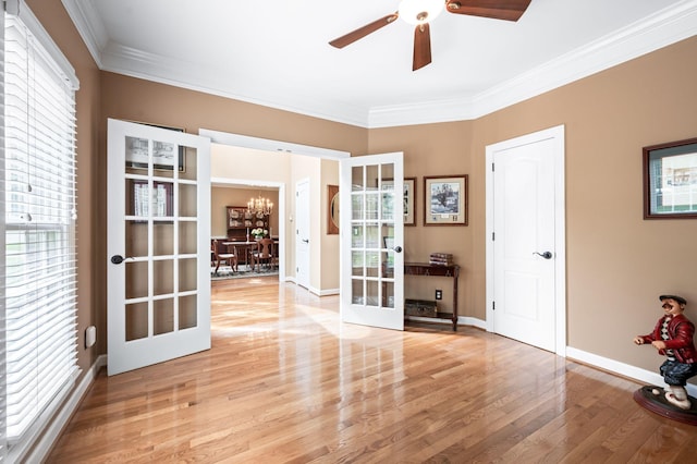 395 Glendower Pl, Franklin, TN 37064 - unfurnished room with french doors, ornamental molding, light wood-style floors, a chandelier, and ceiling fan
