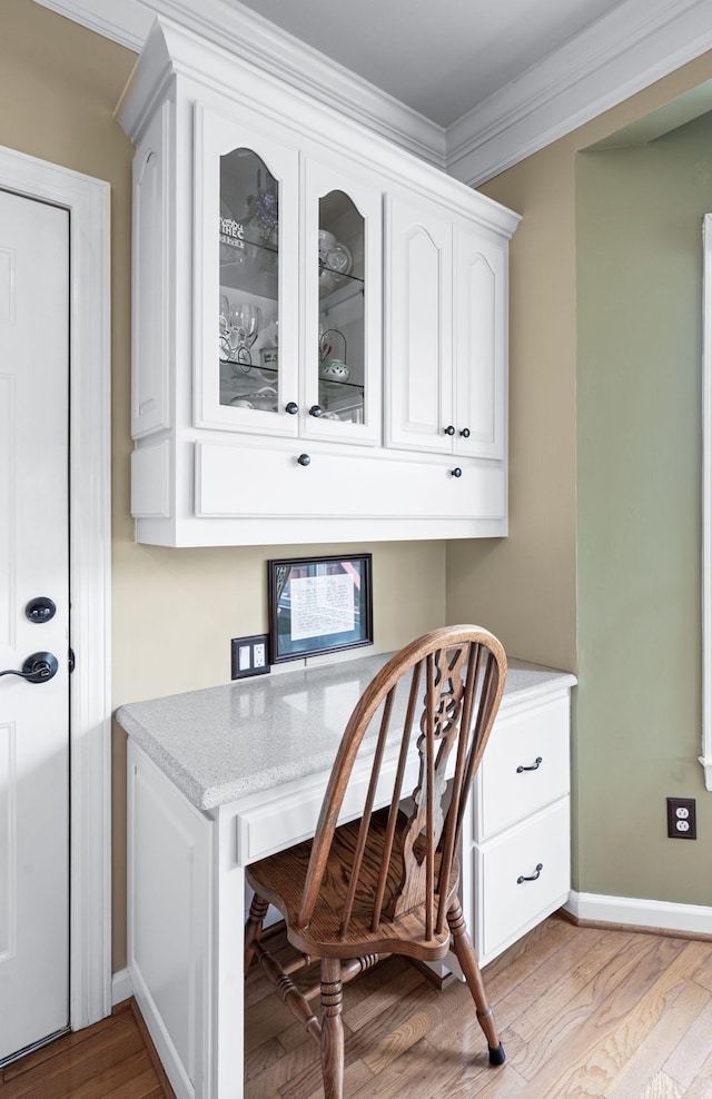 395 Glendower Pl, Franklin, TN 37064 - home office with built in desk, ornamental molding, and light wood-style floors