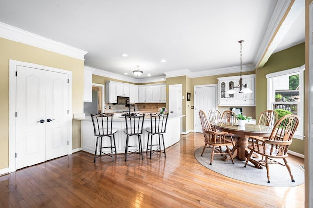 395 Glendower Pl, Franklin, TN 37064 - dining room with hardwood / wood-style floors, recessed lighting, and ornamental molding