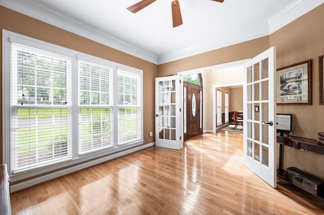 395 Glendower Pl, Franklin, TN 37064 - empty room featuring french doors, ornamental molding, ceiling fan, and light wood-type flooring