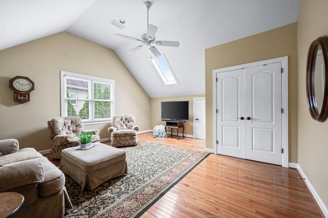 395 Glendower Pl, Franklin, TN 37064 - living room with ceiling fan, light wood-type flooring, a skylight, and lofted ceiling