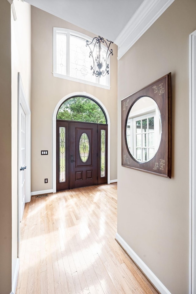 395 Glendower Pl, Franklin, TN 37064 - entryway featuring a chandelier, wood-type flooring, ornamental molding, and a high ceiling