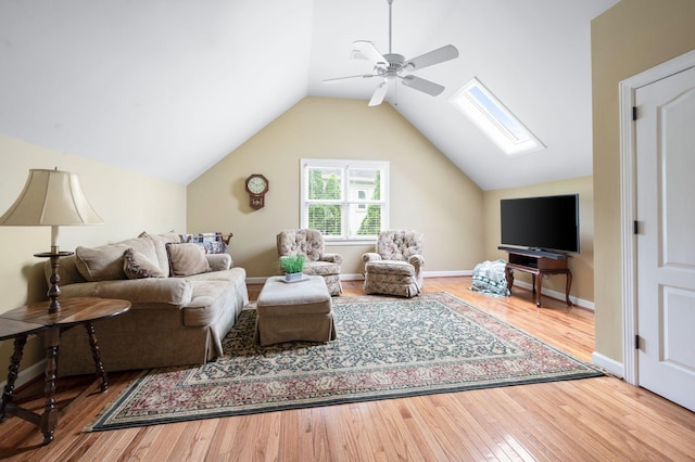 395 Glendower Pl, Franklin, TN 37064 - living area with a skylight, a ceiling fan, wood finished floors, and lofted ceiling