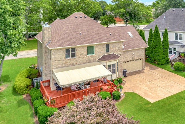 395 Glendower Pl, Franklin, TN 37064 - back of house with a chimney, a deck, roof with shingles, and a garage