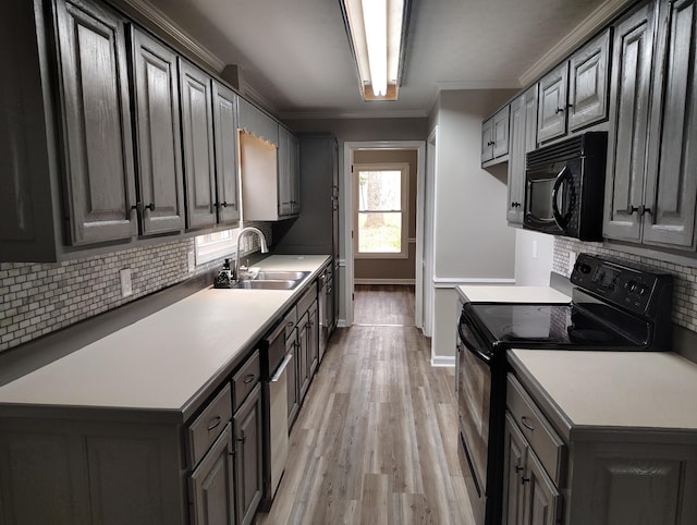 631 Mag A Mor Dr, Lafayette, TN 37083 - kitchen featuring black appliances, light wood-type flooring, backsplash, crown molding, and light countertops