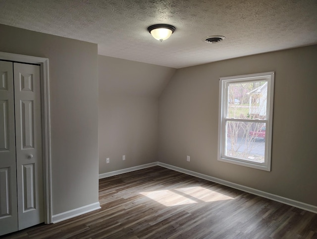 631 Mag A Mor Dr, Lafayette, TN 37083 - bonus room featuring dark wood-style flooring, a textured ceiling, and vaulted ceiling