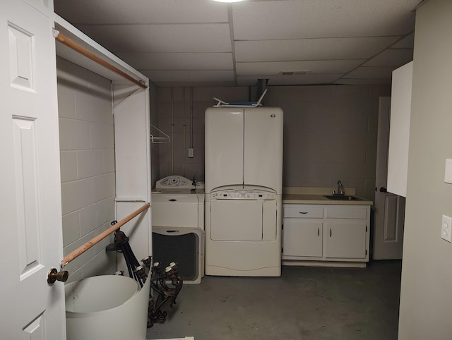 631 Mag A Mor Dr, Lafayette, TN 37083 - below grade area with washer and dryer, concrete block wall, and a paneled ceiling