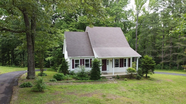 631 Mag A Mor Dr, Lafayette, TN 37083 - view of front of house with a porch, a front lawn, and a forest view