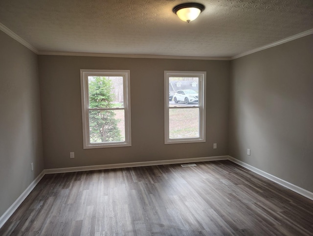 631 Mag A Mor Dr, Lafayette, TN 37083 - spare room featuring dark wood-type flooring, plenty of natural light, a textured ceiling, and ornamental molding