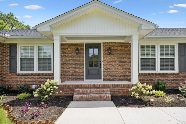 1061 Alford Rd, Murfreesboro, TN 37129 - doorway to property featuring a porch, brick siding, and roof with shingles