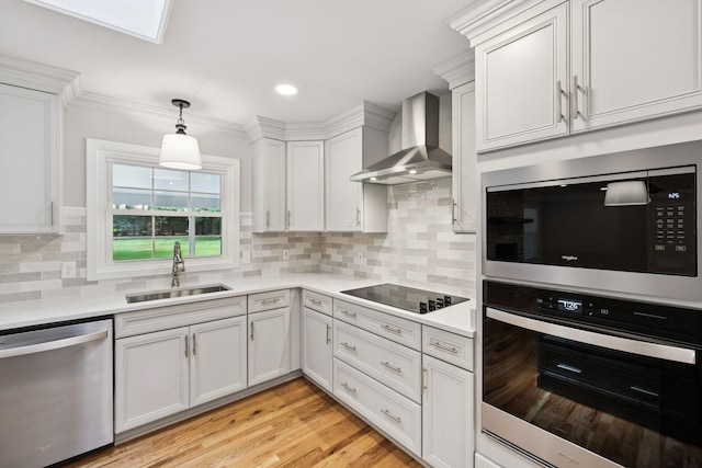 1061 Alford Rd, Murfreesboro, TN 37129 - kitchen featuring stainless steel appliances, wall chimney exhaust hood, light countertops, white cabinetry, and recessed lighting