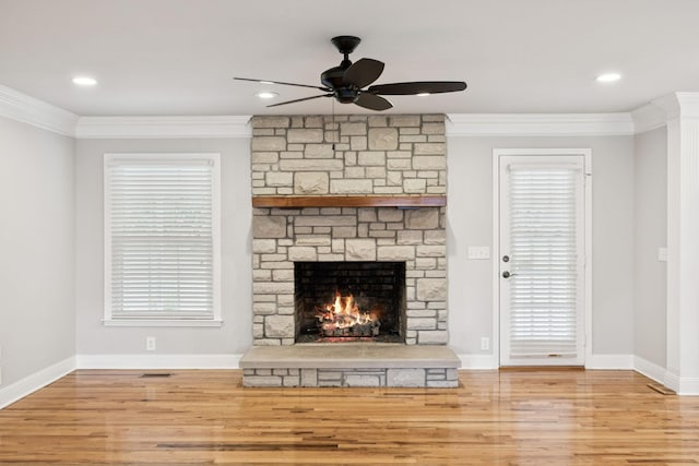 1061 Alford Rd, Murfreesboro, TN 37129 - unfurnished living room featuring wood finished floors, ceiling fan, crown molding, a fireplace, and plenty of natural light
