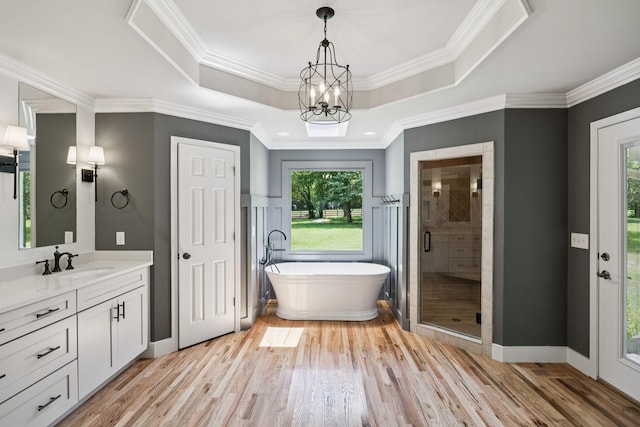 1061 Alford Rd, Murfreesboro, TN 37129 - full bath featuring vanity, a freestanding bath, wood finished floors, plenty of natural light, and crown molding