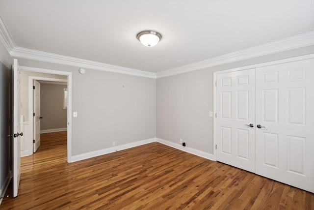 1061 Alford Rd, Murfreesboro, TN 37129 - unfurnished bedroom featuring ornamental molding, wood finished floors, and a closet