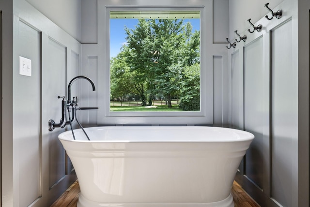 1061 Alford Rd, Murfreesboro, TN 37129 - bathroom featuring a freestanding tub, wood finished floors, and plenty of natural light
