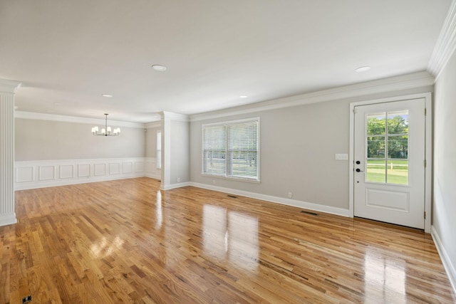 1061 Alford Rd, Murfreesboro, TN 37129 - unfurnished living room featuring crown molding, a chandelier, light wood-style floors, and recessed lighting