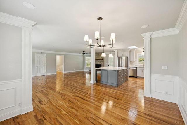 1061 Alford Rd, Murfreesboro, TN 37129 - kitchen with appliances with stainless steel finishes, gray cabinets, healthy amount of natural light, light countertops, and a wainscoted wall