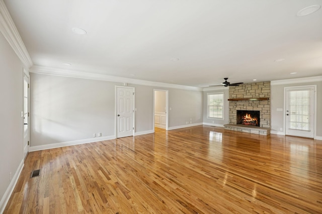 1061 Alford Rd, Murfreesboro, TN 37129 - unfurnished living room featuring light wood finished floors, a ceiling fan, crown molding, a stone fireplace, and recessed lighting