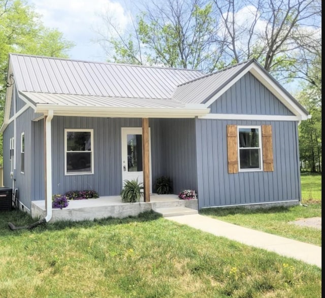 117 Mason St, Woodbury, TN 37190 - view of front of property featuring a porch, a front yard, and a metal roof