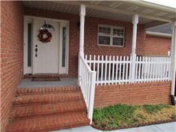 1008 Shirley Dr, Lebanon, TN 37087 - entrance to property featuring brick siding and covered porch