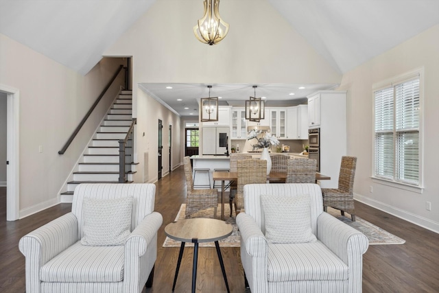 773 Curve St, Chattanooga, TN 37405 - living area with a chandelier, high vaulted ceiling, stairway, and dark wood finished floors