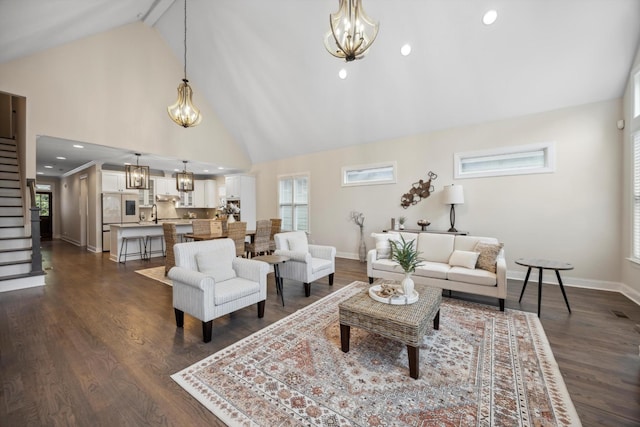 773 Curve St, Chattanooga, TN 37405 - living area featuring a chandelier, high vaulted ceiling, dark wood-style flooring, healthy amount of natural light, and stairway