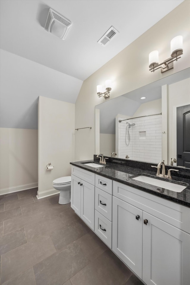 773 Curve St, Chattanooga, TN 37405 - full bath with double vanity, lofted ceiling, and tiled shower