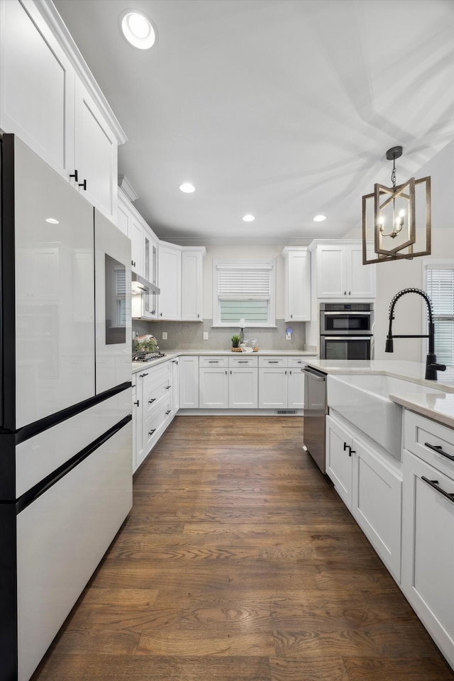 773 Curve St, Chattanooga, TN 37405 - kitchen with appliances with stainless steel finishes, white cabinetry, light countertops, and recessed lighting